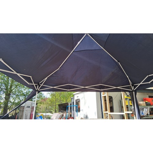 226 - Collapsible pop-up gazebo with navy polyester canopy and white metal scissor-frame supports; shown a... 
