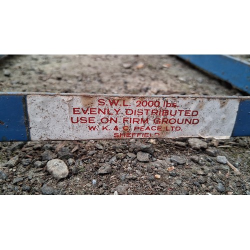 228 - A pair of blue-painted steel loading ramps, stencilled with safe working load 2000 lbs and maker’s d... 