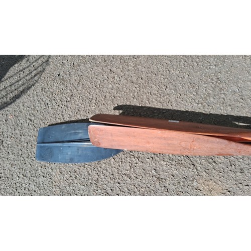 231 - 3 canoe or kayak paddles, 2 with wooden shafts and 1 double plastic blade.