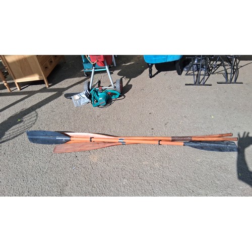 231 - 3 canoe or kayak paddles, 2 with wooden shafts and 1 double plastic blade.