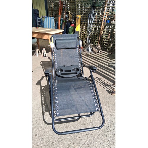 239 - Raxter gravity recliner chair, and removable plastic tray with twin cupholders and compartments, mod... 