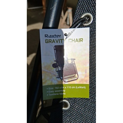239 - Raxter gravity recliner chair, and removable plastic tray with twin cupholders and compartments, mod... 