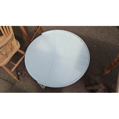 242 - Contemporary circular coffee table with clear glass top within a white-painted metal frame.