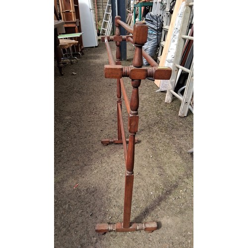 243 - An early 20th century stained beech clothes airer.