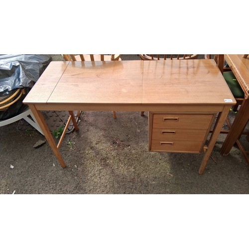 244 - Mid-Century modern teak writing desk, fitted with three drawers.