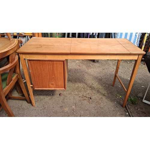 244 - Mid-Century modern teak writing desk, fitted with three drawers.