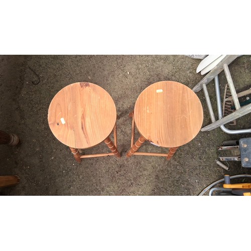 245 - A pair of turned pine bar stools.