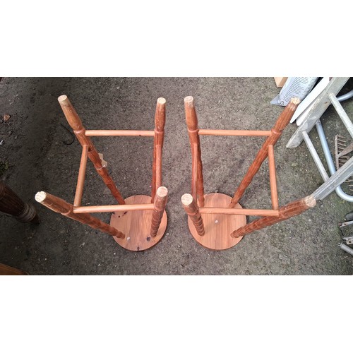 245 - A pair of turned pine bar stools.
