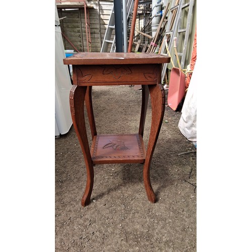 248A - 20th century carved oak occasional table, with bold floral relief border and an undertier carved wit... 