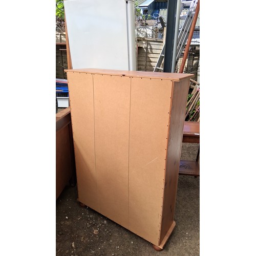 249A - Pine open bookcase, raised on a plinth base with bun feet.