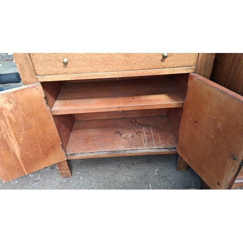 250A - Early 20th century oak hall stand with iron coat hooks, over a divided drawer and cupboard.