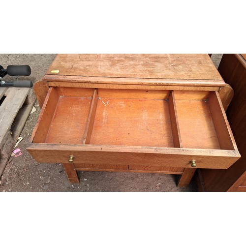 250A - Early 20th century oak hall stand with iron coat hooks, over a divided drawer and cupboard.