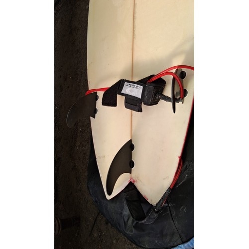 211 - Surfboard with thruster fin set-up and red leash, in a black zippered board bag.