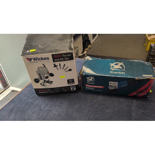 A group of modern power tools comprising a Wickes Professional 900W ...