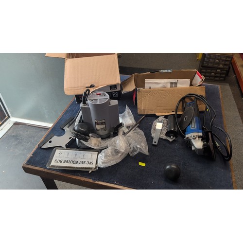 A group of modern power tools comprising a Wickes Professional 900W ...