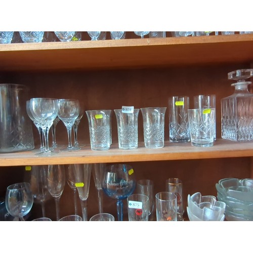 874 - A quantity of cut-glass tablewares including a decanter with faceted stopper, a glass jug, and assor... 