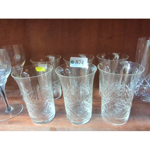 874 - A quantity of cut-glass tablewares including a decanter with faceted stopper, a glass jug, and assor... 