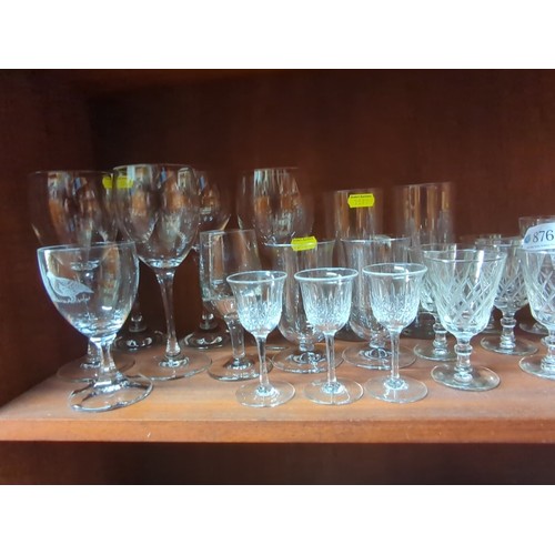 876 - A quantity of mixed table glass, including stemware and tumblers, some wheel-engraved and cut with c... 