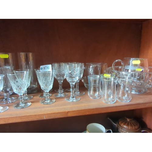 876 - A quantity of mixed table glass, including stemware and tumblers, some wheel-engraved and cut with c... 