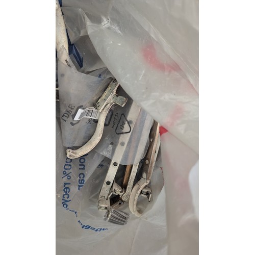 244b - A quantity of mixed door and cabinet hardware, including brass and iron pull handles, escutcheons, r... 