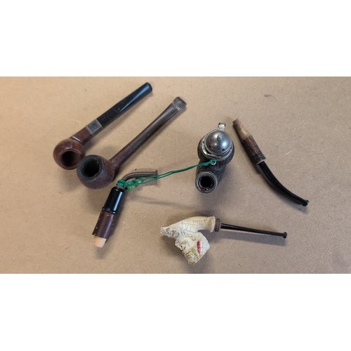 604 - Smoking memorabilia inc. two briar tobacco pipes, one novelty figural meerschaum-style pipe bowl wit... 