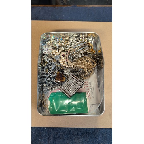 608 - Box of costume jewellery including faux pearls, rhinestone-set bracelets and ring, hair comb, brooch... 