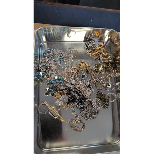 608 - Box of costume jewellery including faux pearls, rhinestone-set bracelets and ring, hair comb, brooch... 