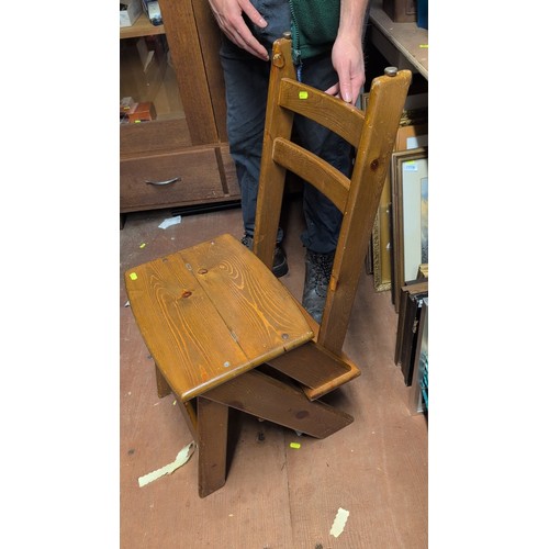 247 - Pine library steps, the hinged section converting to a three-rung chair-back support, on splayed leg... 