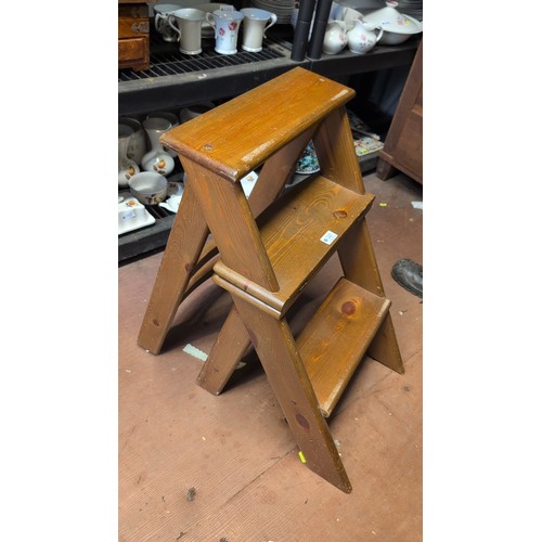 247 - Pine library steps, the hinged section converting to a three-rung chair-back support, on splayed leg... 