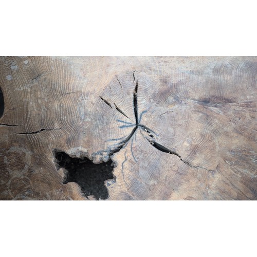 248 - Rustic hardwood occasional table, the free-form slab top displaying natural edge, supported on three... 