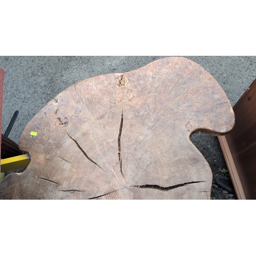 248 - Rustic hardwood occasional table, the free-form slab top displaying natural edge, supported on three... 
