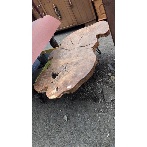 248 - Rustic hardwood occasional table, the free-form slab top displaying natural edge, supported on three... 