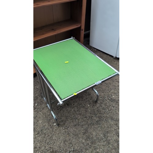 249 - Mid-Century Modern chrome-plated occasional table, the rectangular green glass top within a tubular ... 