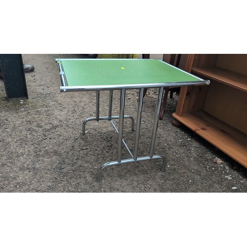 249 - Mid-Century Modern chrome-plated occasional table, the rectangular green glass top within a tubular ... 