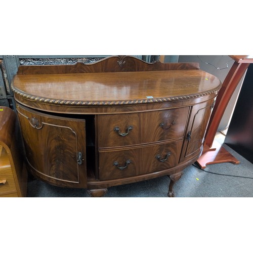1017 - Bow-front mahogany sideboard, early 20th century, with gadrooned edge and shaped gallery, fitted wit... 