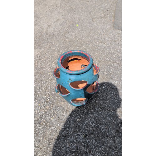 102a - A terracotta strawberry jar, turquoise-painted; the interior left unglazed, with central drainage ho... 