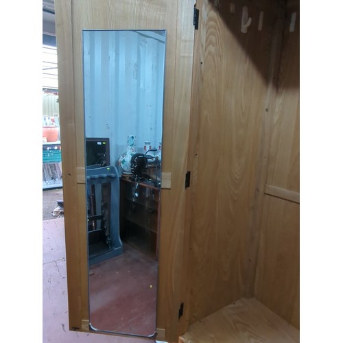 212A - Contemporary wardrobe, the arched cornice above two panelled doors with turned wooden knobs and a ro... 