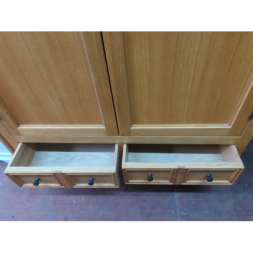 212A - Contemporary wardrobe, the arched cornice above two panelled doors with turned wooden knobs and a ro... 