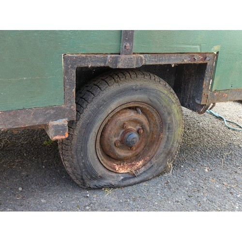 80 - Single-axle utility trailer with green panelled sides and steel frame, open box body with internal s... 