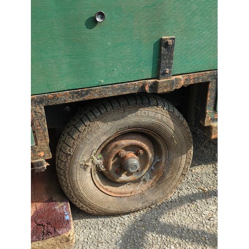 80 - Single-axle utility trailer with green panelled sides and steel frame, open box body with internal s... 