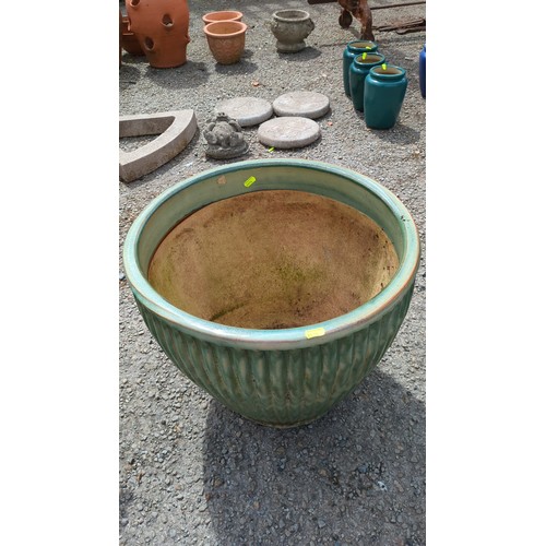 88 - Large glazed stoneware jardinière; in mottled celadon-green glaze.