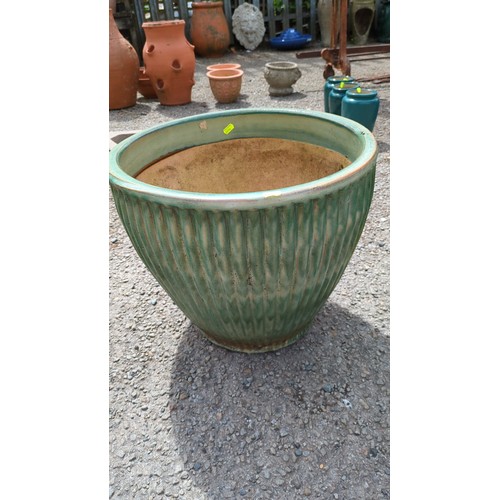 88 - Large glazed stoneware jardinière; in mottled celadon-green glaze.