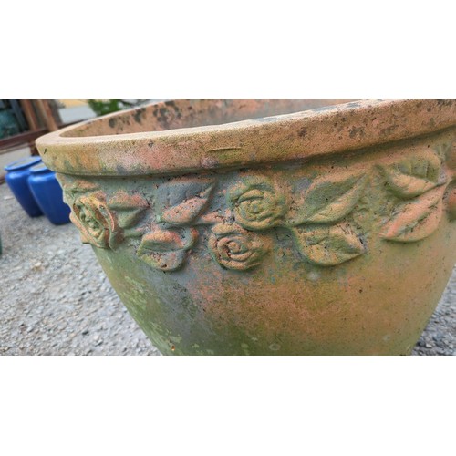 89 - Large terracotta garden planter with moulded foliate and rose garland frieze.