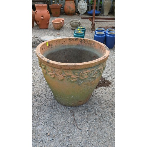 89 - Large terracotta garden planter with moulded foliate and rose garland frieze.