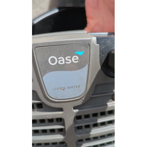 94 - Oase preformed pond set comprising a black plastic pond liner and a lidded tub housing an Oase Filtr... 