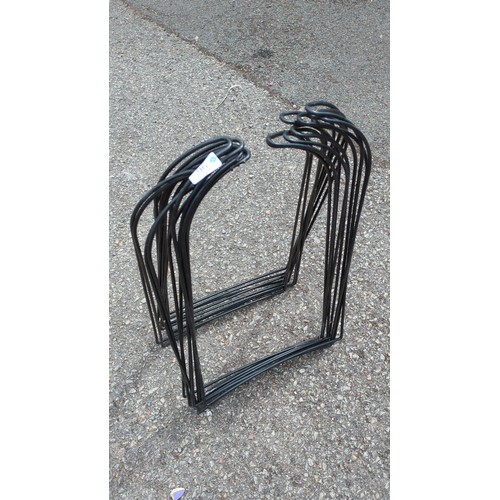 96 - A set of black painted steel garden edging hurdles.