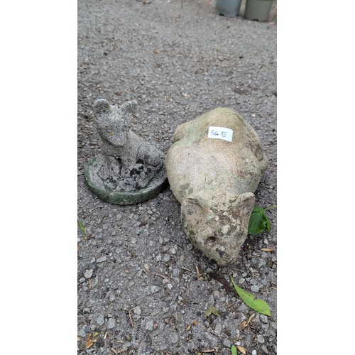 84e - Two cast stone garden ornaments, one modelled as reclining cat