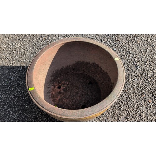 59B - Large moulded terracotta jardinière of wide circular form with thick rolled rim, painted with ochre... 