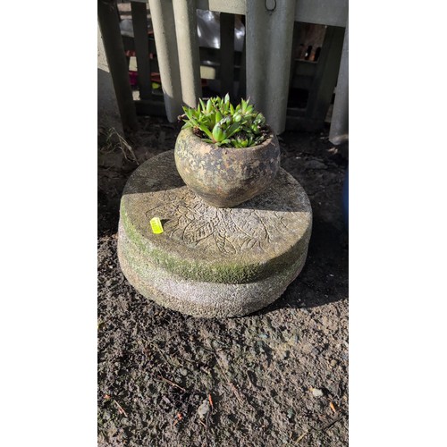 59d - A group of three cast stone garden stepping stones of circular form, each moulded in relief with flo... 