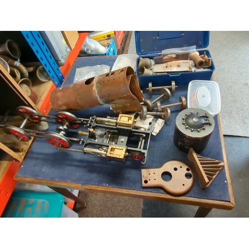 A group of model steam locomotive engineering components, including a ...